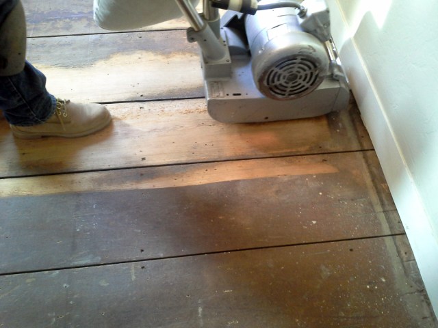 After we got all the linoleum up, 2 layers and the plywood subloor, Peter rented the sander and got to the sanding